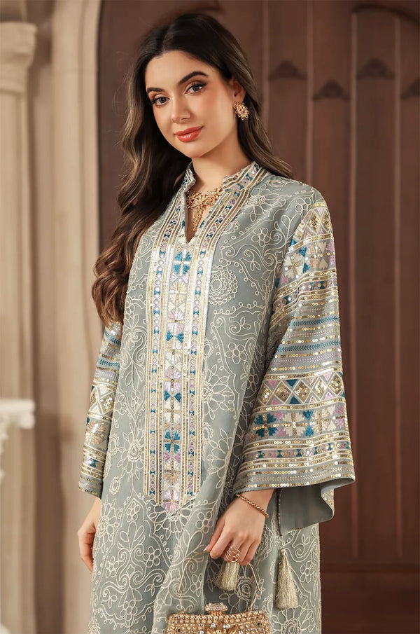Close-up of the Orla light green kaftan’s upper body showing the embellished Mandarin collar and sleeve patterns.