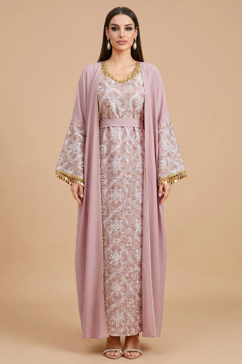 Full front view of the powder pink Novae crepe kaftan from Naylara, showcasing the intricate medallion embroidery and coin details.