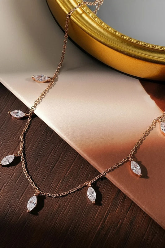 S925 18K rose gold station necklace with leaf shaped stones on display