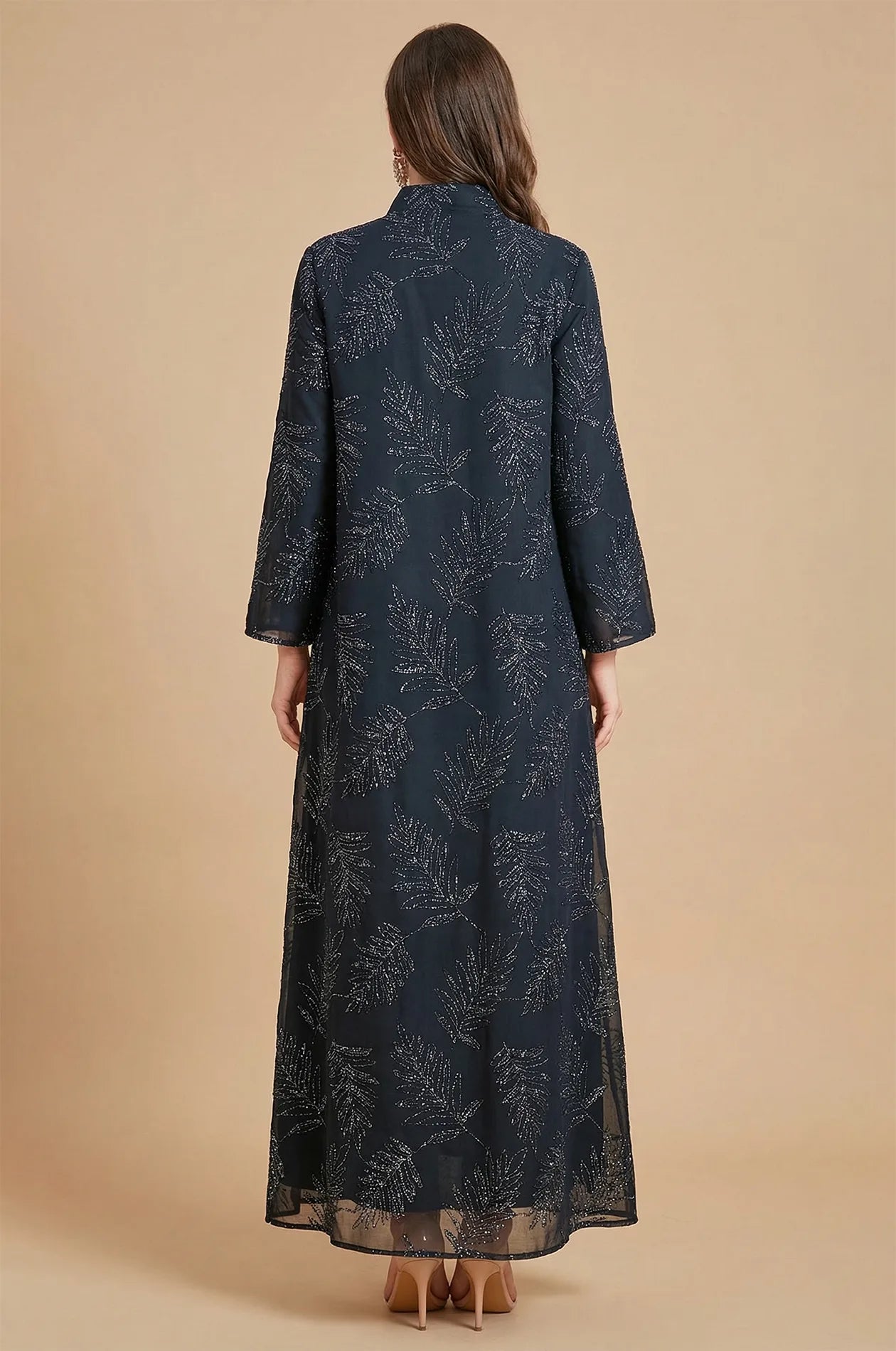 Back view of the Saria black plus size sheer kaftan showcasing the consistent silver leaf motifs across the premium sheer fabric.