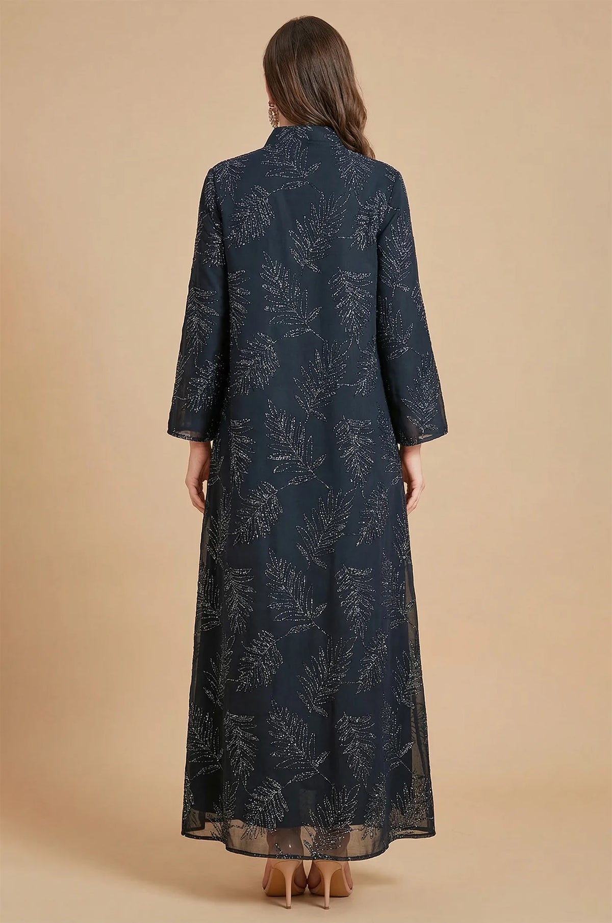 Back view of the Saria black plus size sheer kaftan showcasing the consistent silver leaf motifs across the premium sheer fabric.