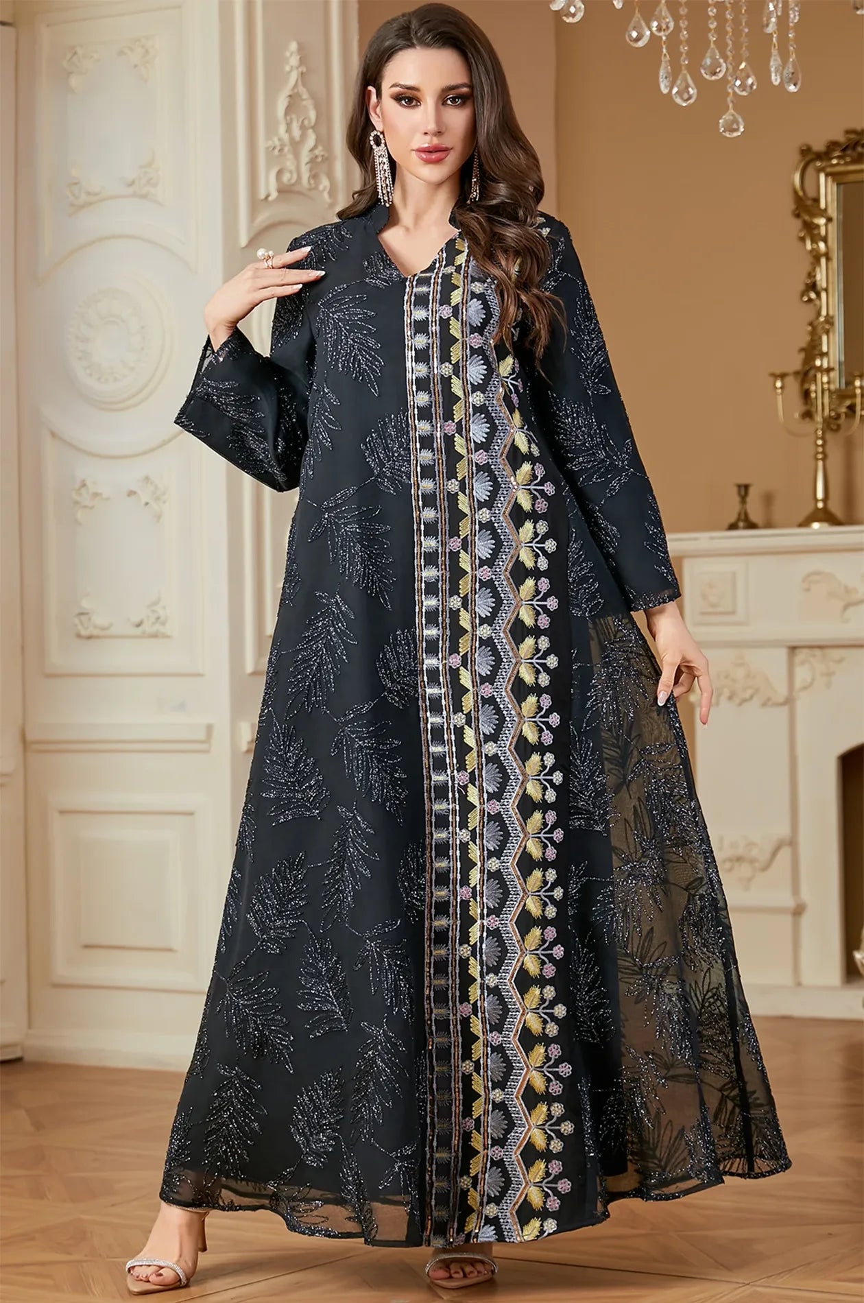 A frontal lifestyle shot of the Saria black plus size sheer kaftan, demonstrating its sophisticated look for weddings or parties.