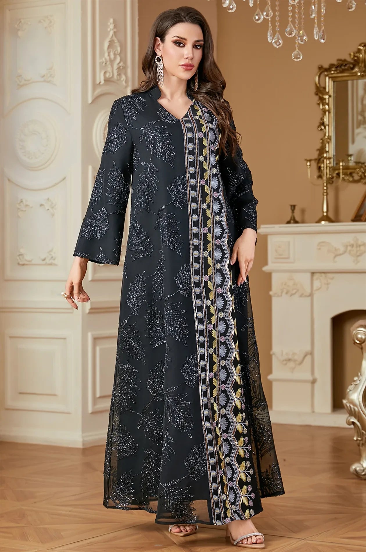 Dynamic pose of the Saria black plus size sheer kaftan highlighting the shimmering beadwork and breathable long sleeves.
