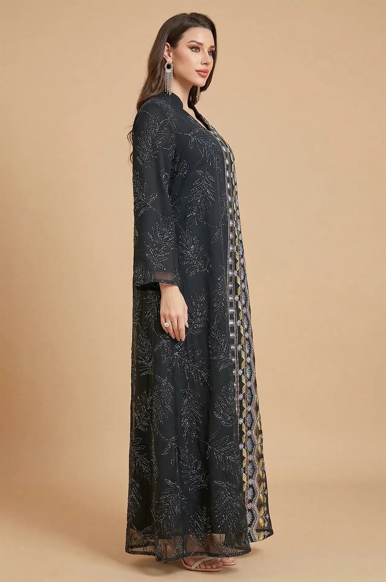 Side profile of the Saria black plus size sheer kaftan illustrating the graceful drape and lightweight flow of the garment.