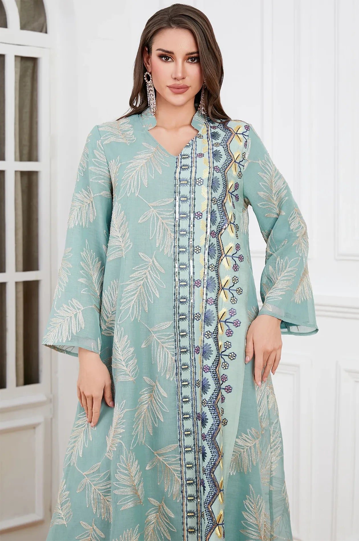 Close-up of the V-neckline and artisanal beaded floral border on the Saria gray plus size sheer kaftan.