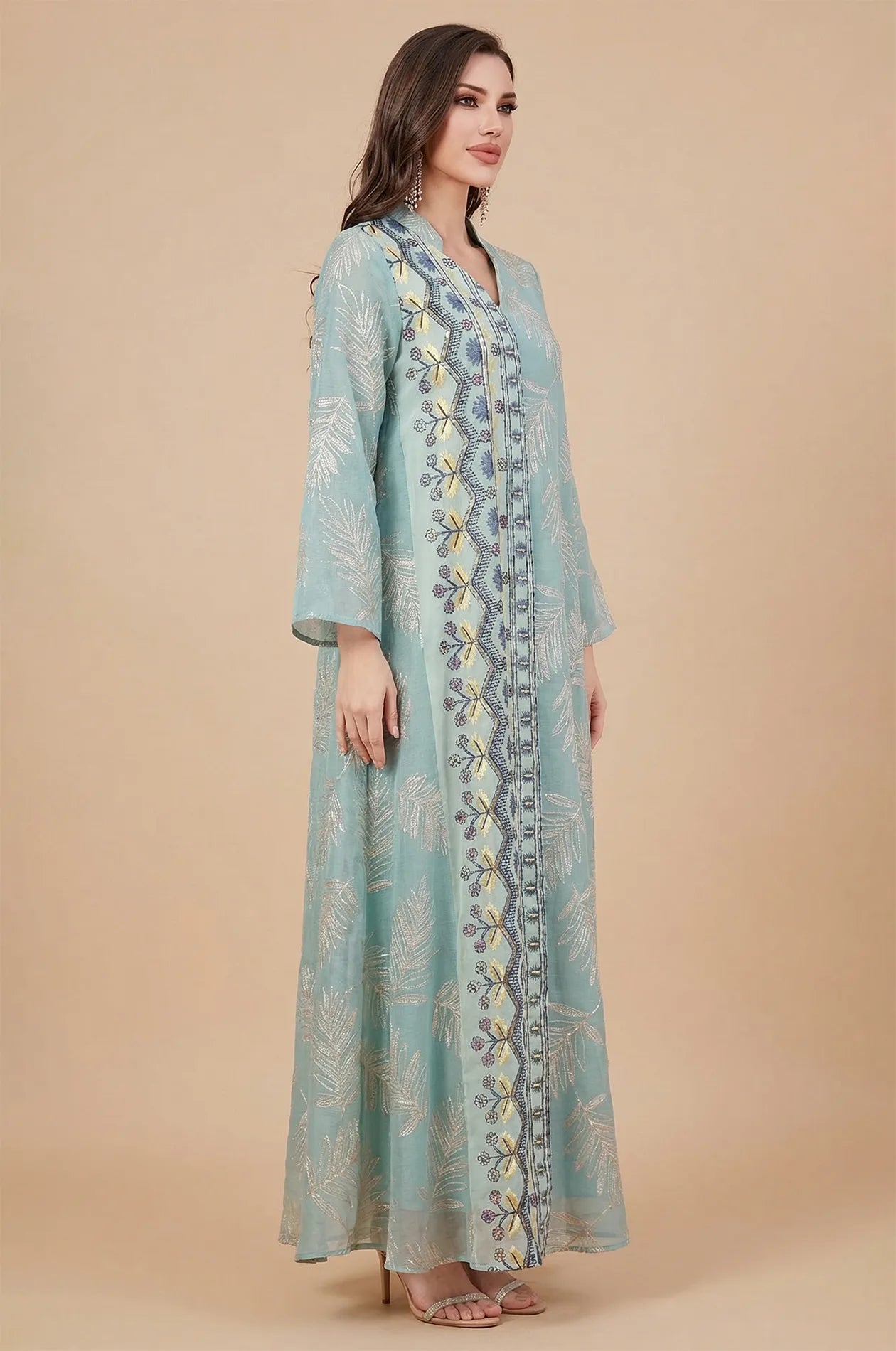 Side profile of a plus size sheer kaftan in gray highlighting the vertical floral beaded panel and wide sleeves.