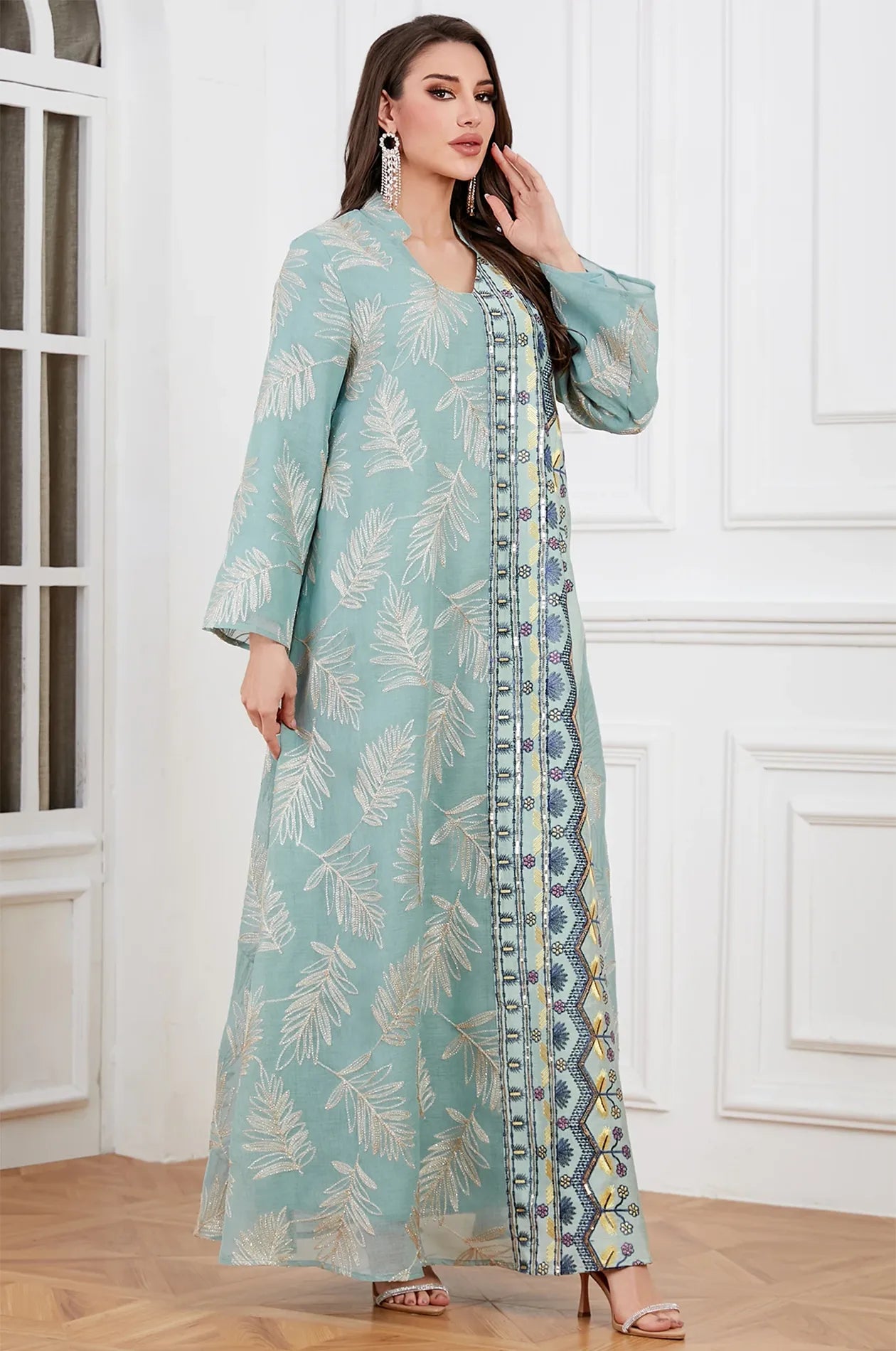 Elegant fashion pose featuring the gray Saria kaftan, perfect for weddings and high-end formal events.