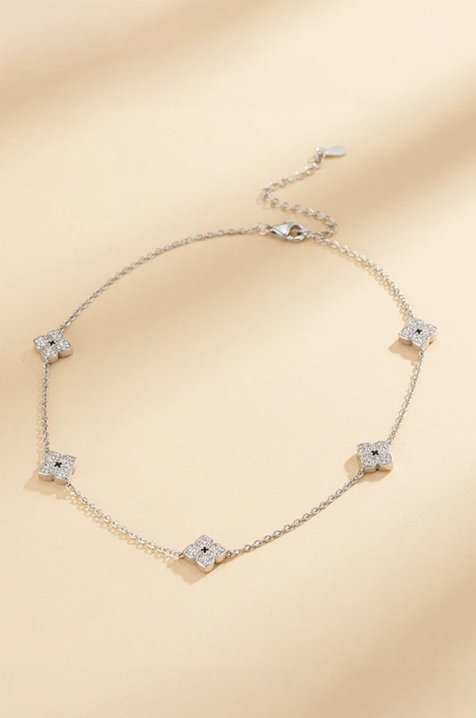 Silver chain necklace featuring crystal encrusted flower motifs for kaftan accessorizing