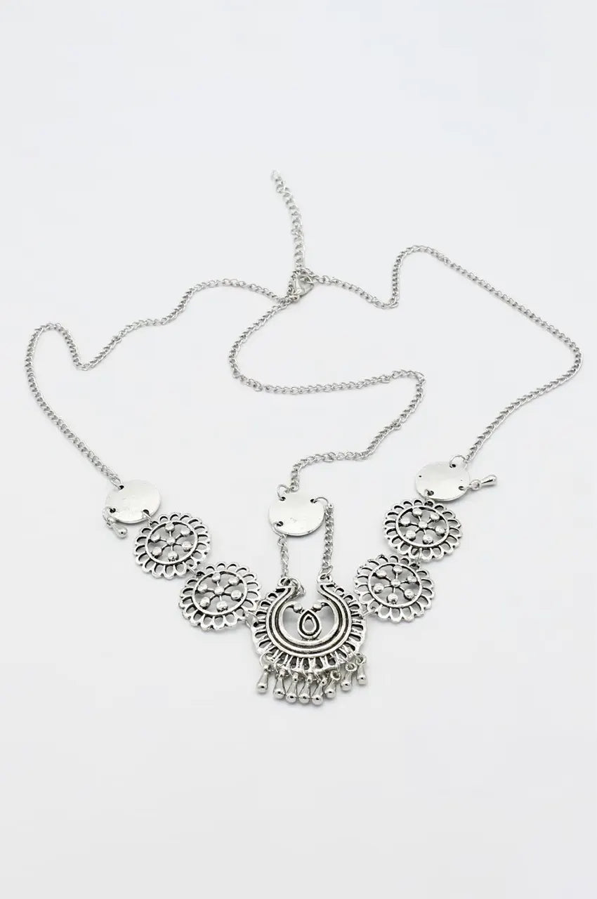 Studio shot of the silver head chain accessory for Takchita, showing the central pendant and adjustable chain.