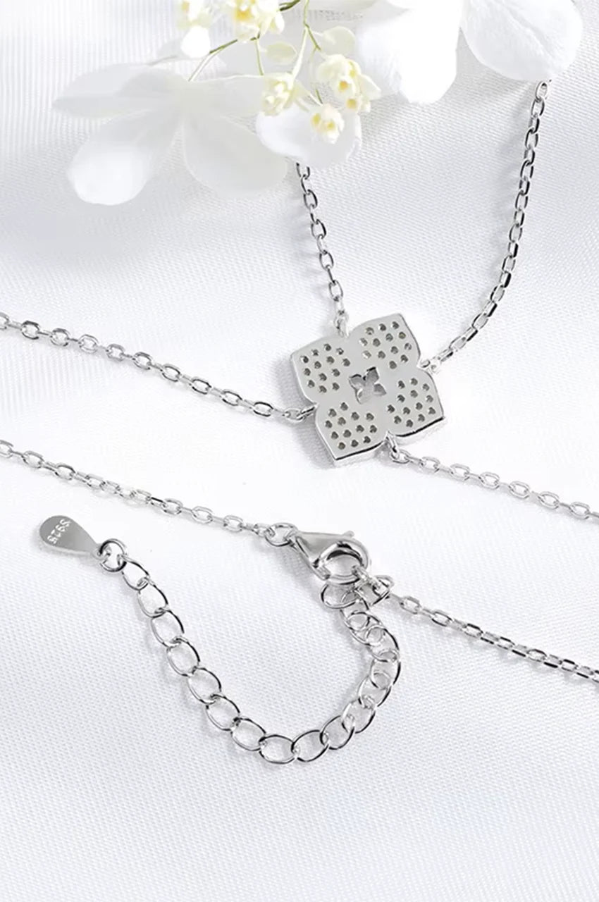 Detail of S925 stamp and lobster clasp on back of silver floral necklace