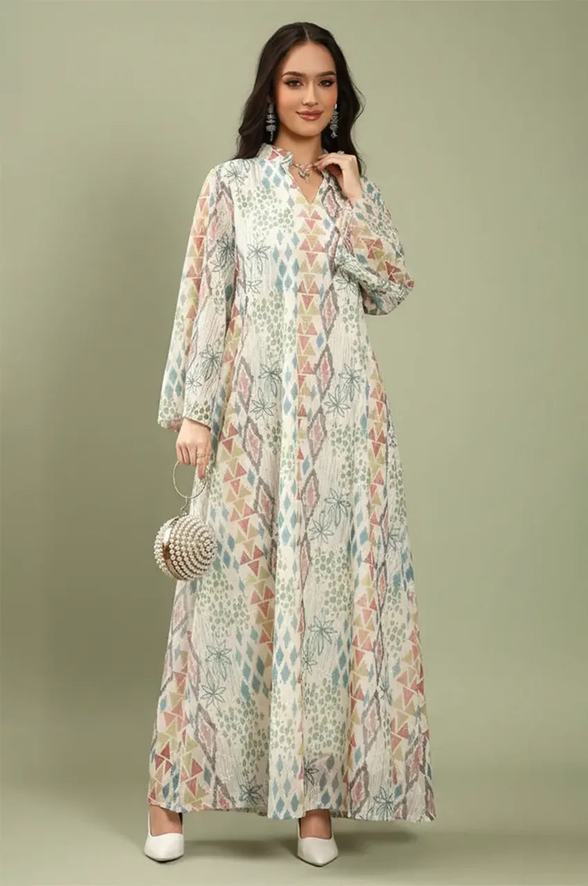 Tyrah white geometric print kaftan from Naylara styled with a pearl clutch for a modest luxury look.