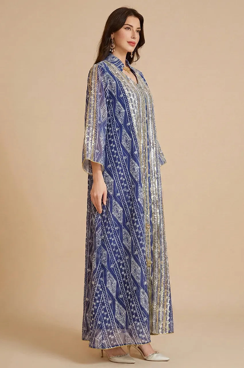 Side profile shot of the Naylara Yara Syrian Kaftan in Blue, showcasing the elegant drape and floor-length cut.