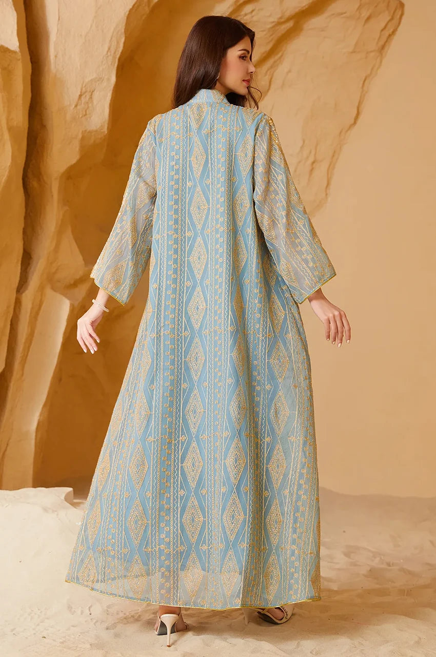 Detailed back view highlighting the intricate tribal-inspired embroidery on the green chiffon fabric.