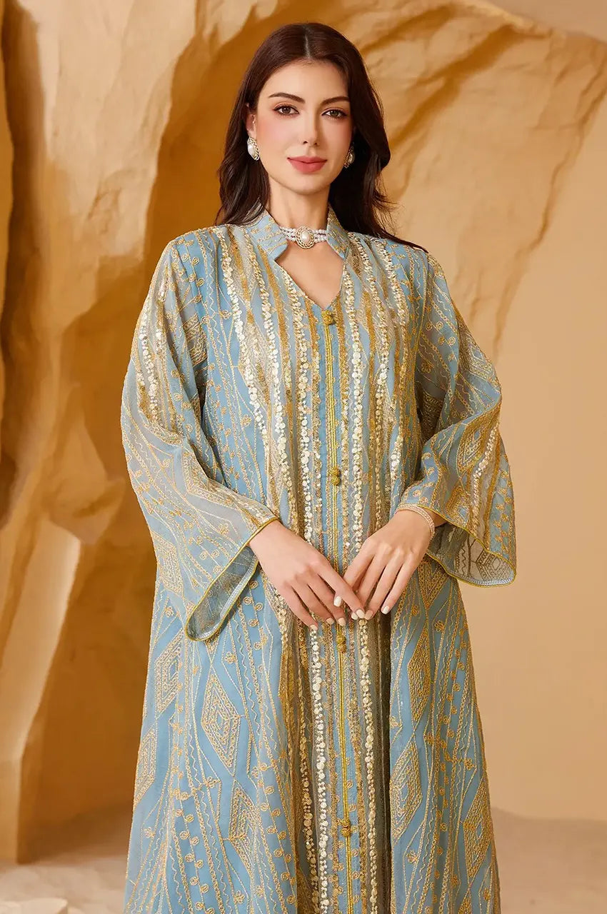 Close-up of the high-neck collar and geometric gold beadwork on the Yara Green Kaftan.