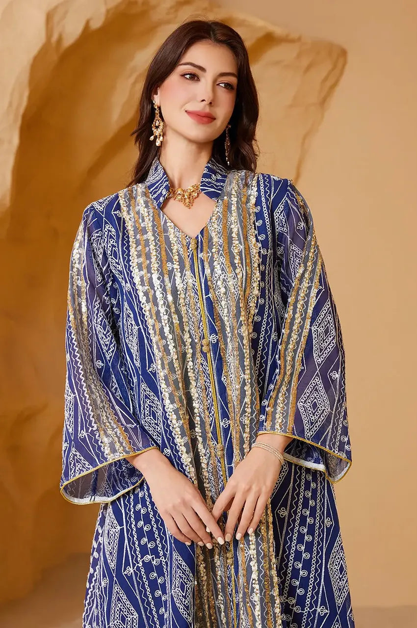 Close-up detail of the heavy gold sequin work and high-neck collar on the Yara Blue Syrian Kaftan.