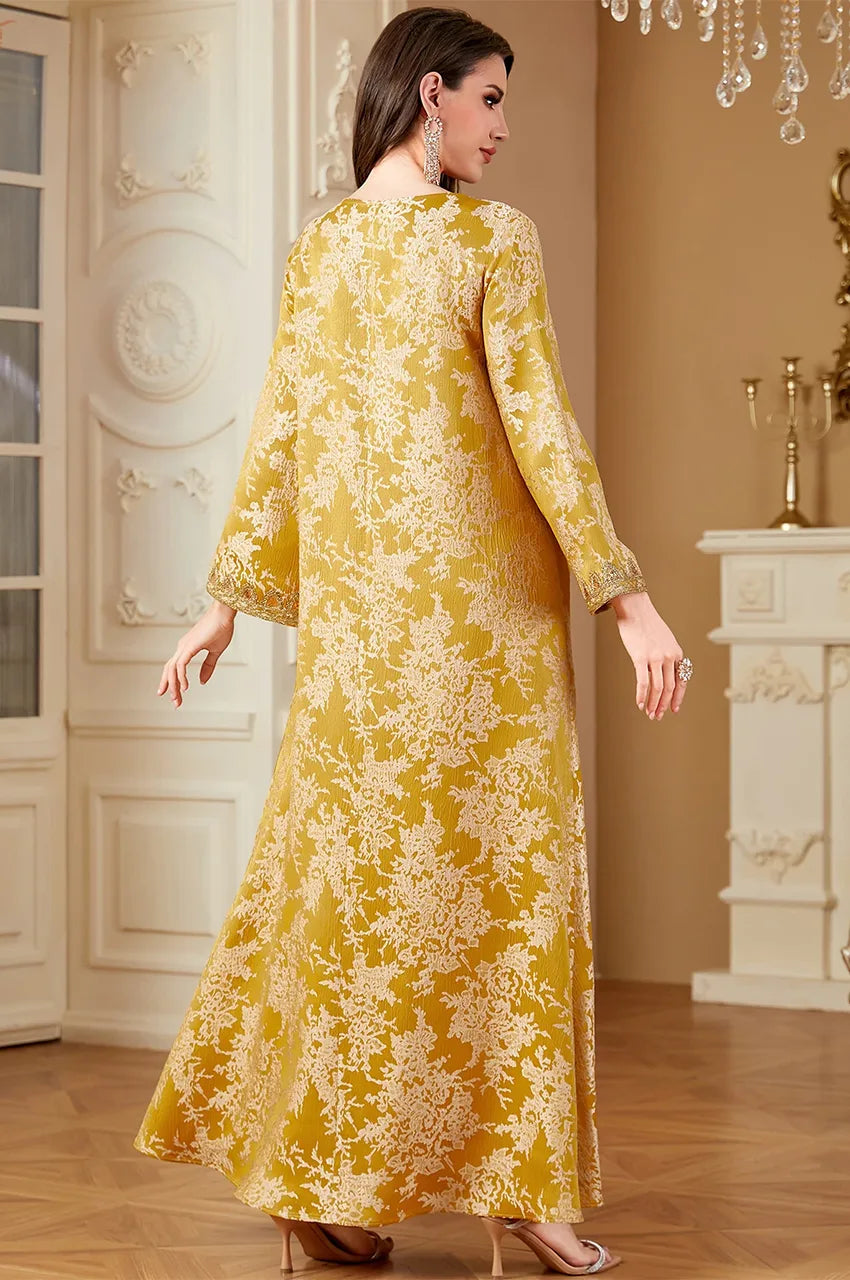 Back view of Zafra mustard yellow jacquard kaftan showing floral pattern and maxi length.