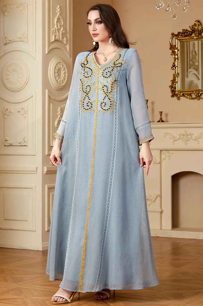 Zaliya Gray kaftan dress featuring intricate gold and black chest embroidery and V-neckline.