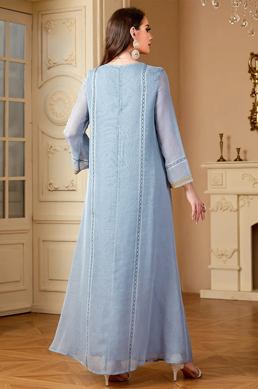 Rear angle view of Zaliya Gray luxury resort wear kaftan highlighting fabric drape and sleeve finish.