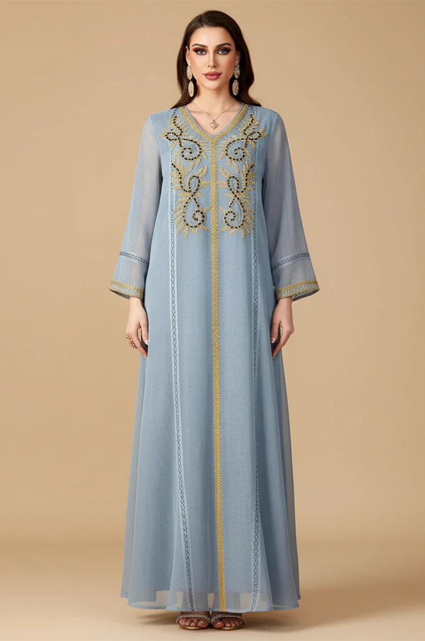 Full-length Zaliya Gray modest evening dress with vertical piping and embroidered cuffs.
