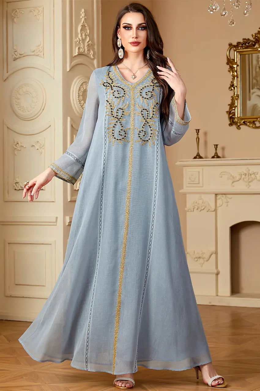 Front view of Zaliya Gray traditional Egyptian kaftan showing fluid linen-blend fabric and gold embroidery.