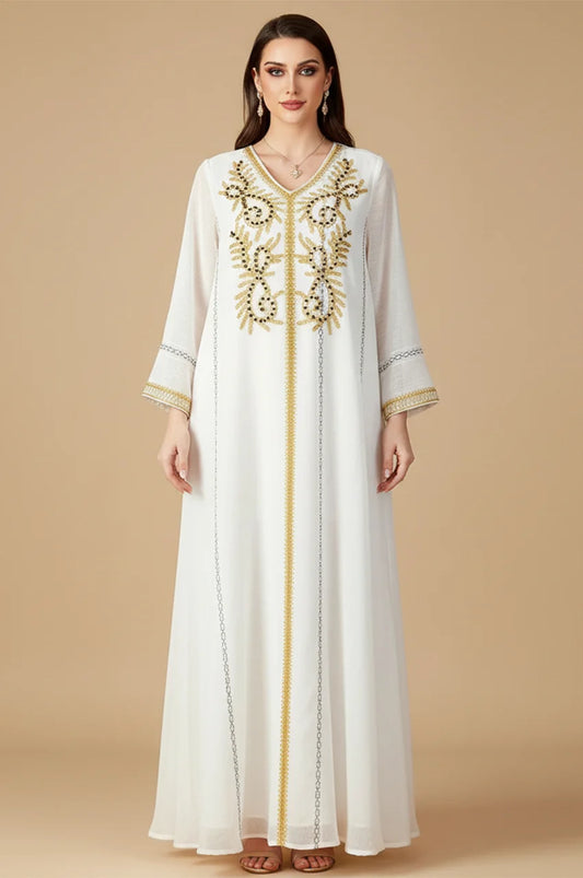 Front view of Zaliya White Egyptian kaftan featuring gold embroidery and modest V-neckline.
