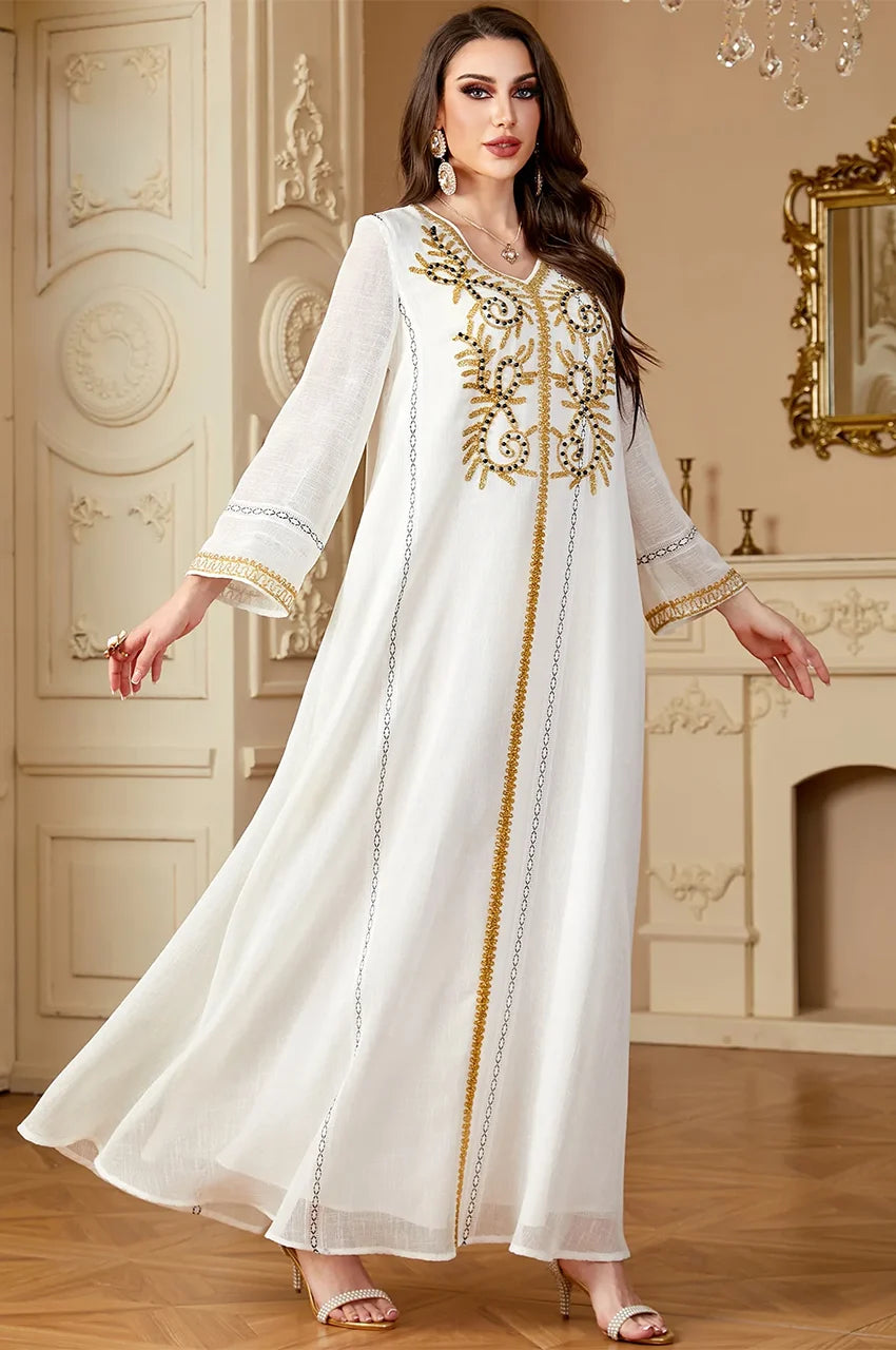 Elegant Zaliya White kaftan in motion, displaying breathable linen-blend fabric for summer events.
