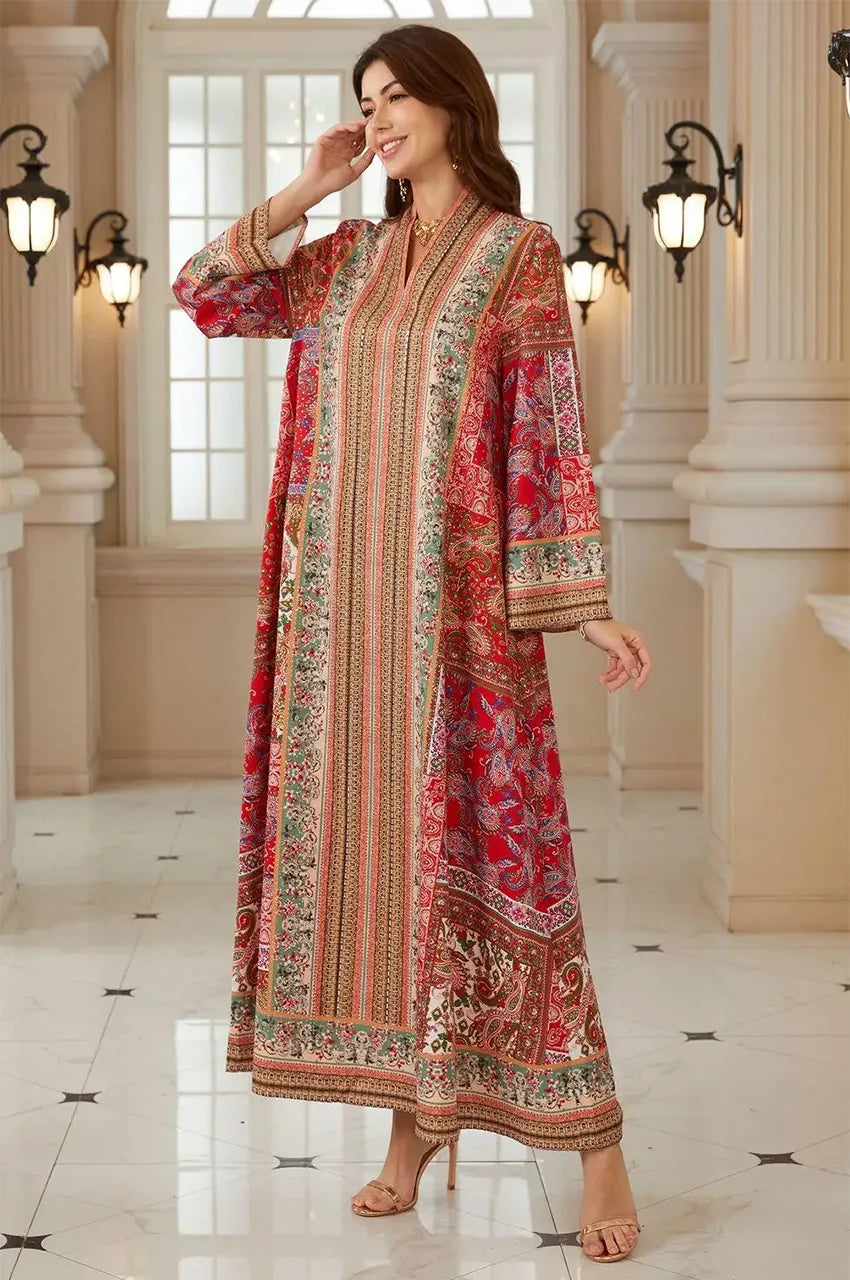 Side view of the Zarin Red Kaftan demonstrating the fluid fabric and A-line silhouette.