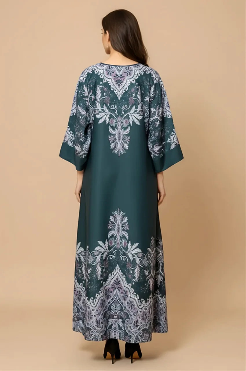 Back view showing intricate paisley print placement on the Nayra emerald modest kaftan dress.