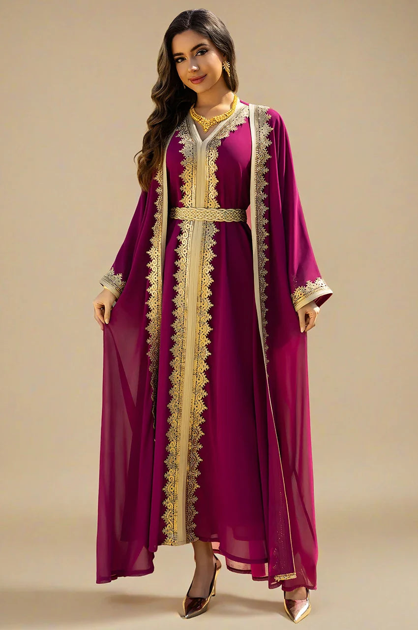 High-resolution detail of the gold embroidery and sheer fabric on the NAYRA hot pink kaftan.