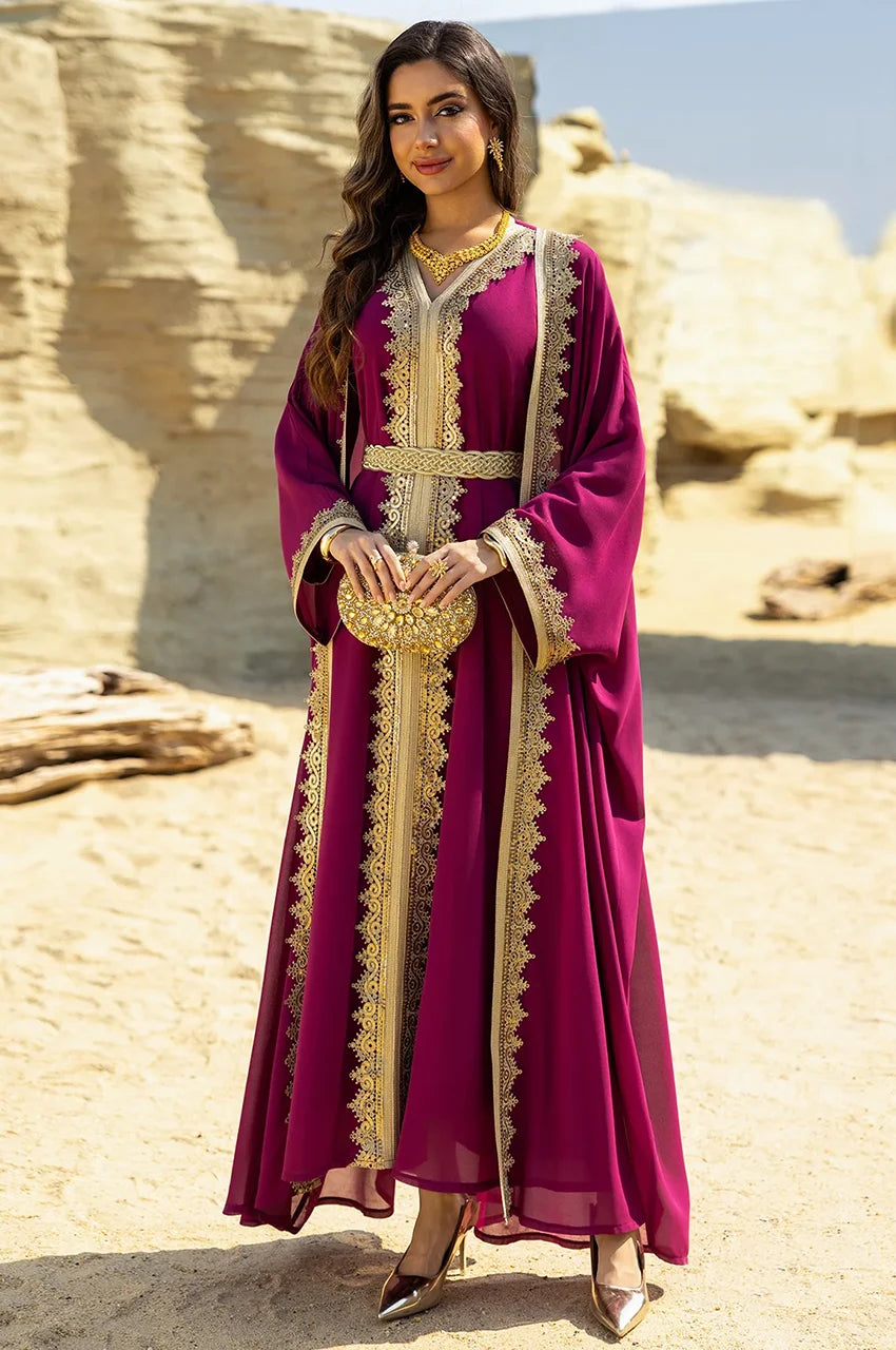 Full lifestyle shot of the NAYRA hot pink long sheer kaftan set with gold accessories.