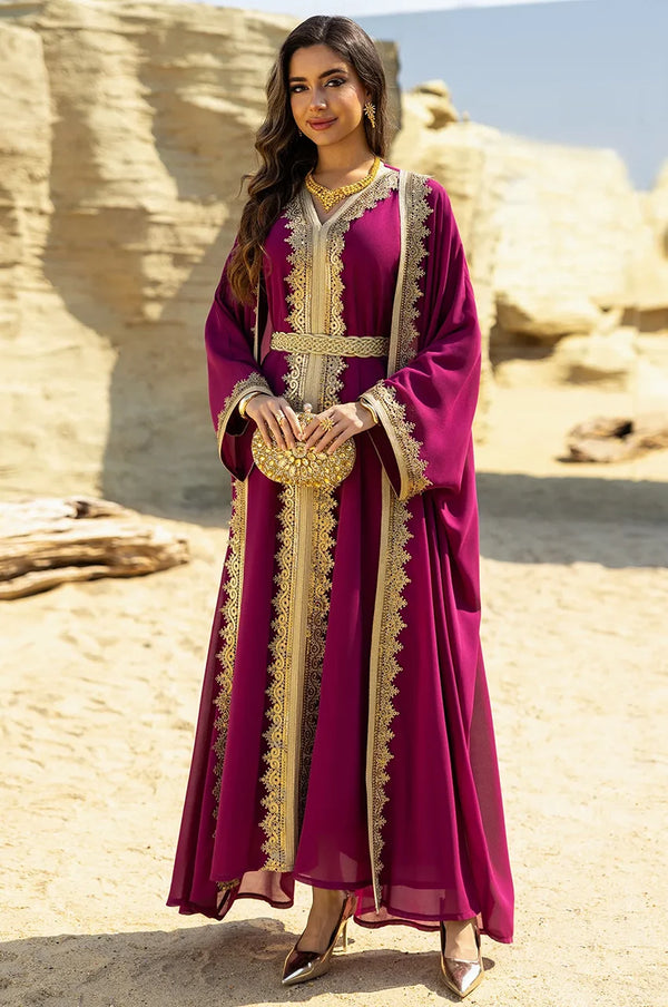 Full lifestyle shot of the NAYRA hot pink long sheer kaftan set with gold accessories.