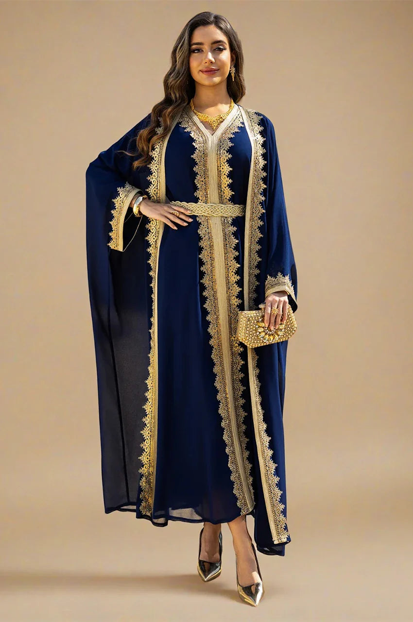 NAYRA royal blue long sheer kaftan paired with a gold evening clutch and belt.