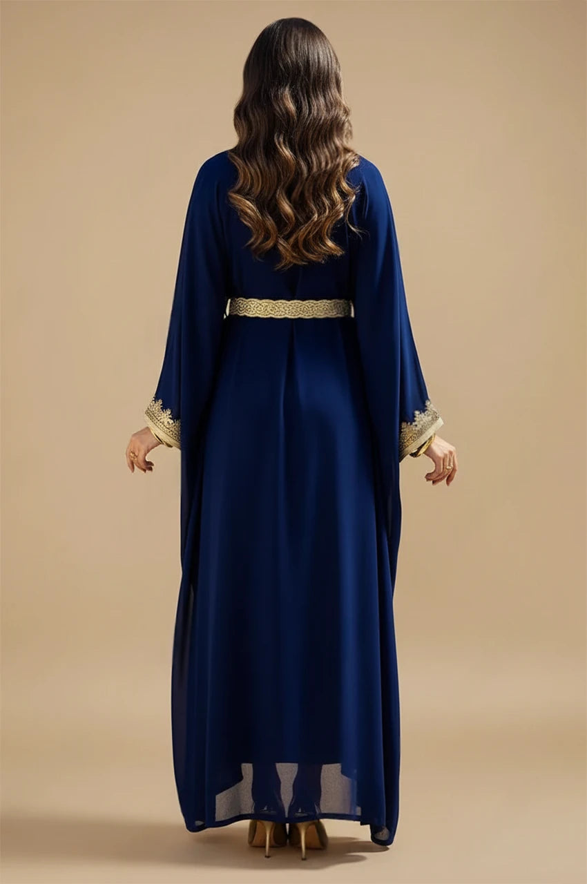 Back view of NAYRA long sheer kaftan in royal blue showing fluid chiffon drape.