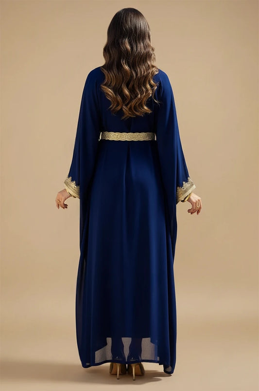 Back view of NAYRA long sheer kaftan in royal blue showing fluid chiffon drape.