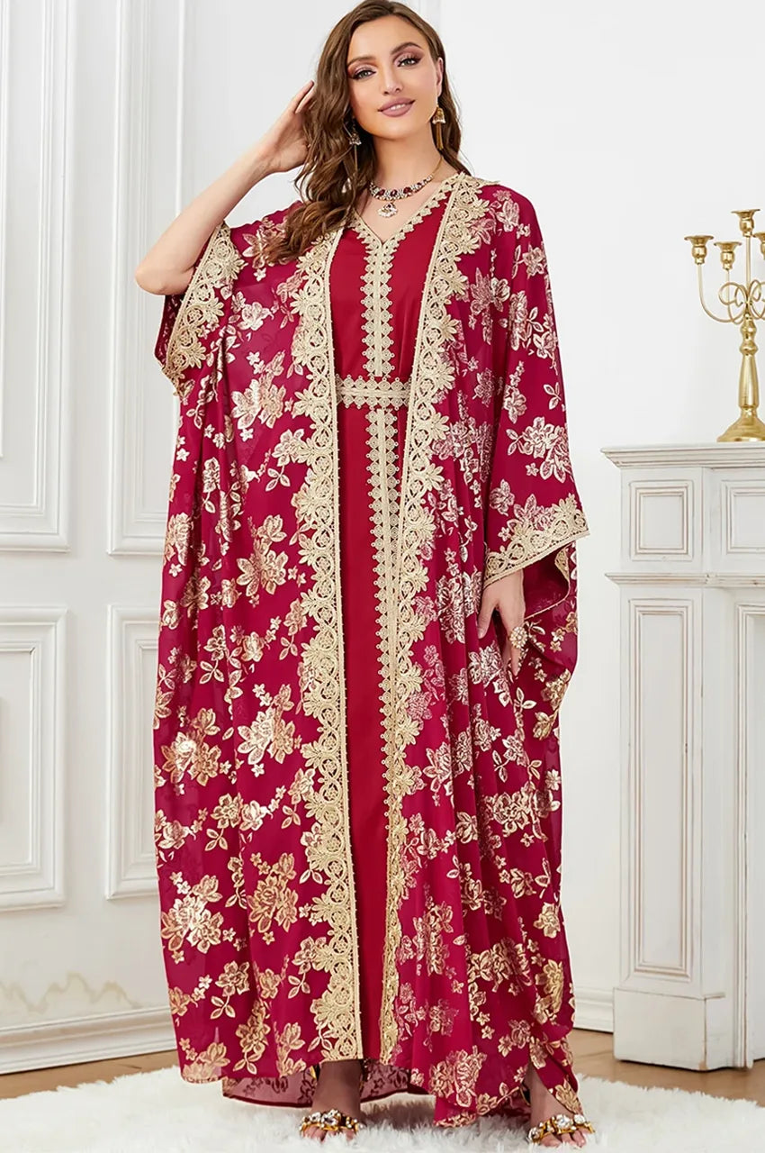 Standing full-length view of the Nehya red floral print kaftan dress for wedding guests.
