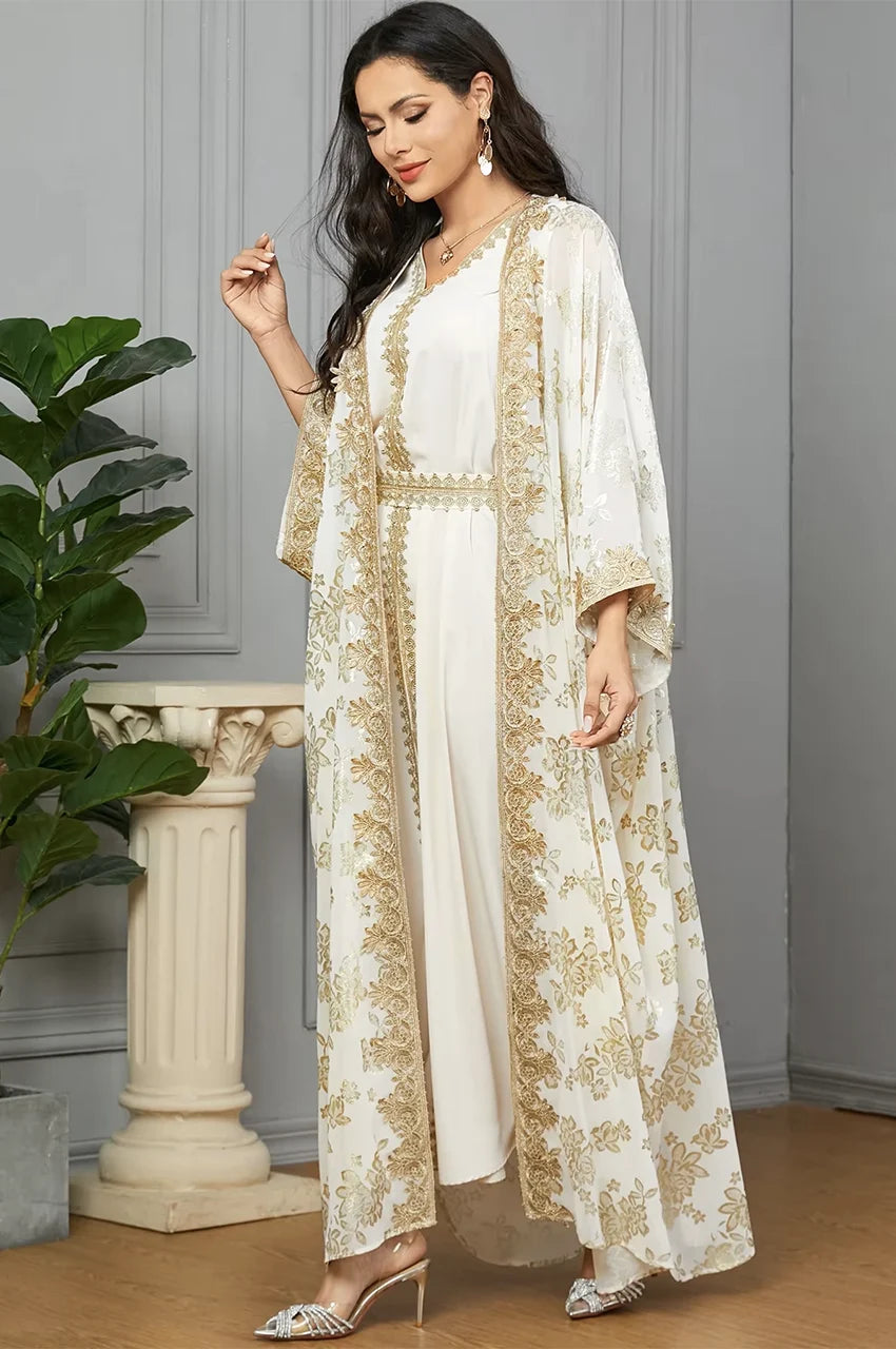 Side view of the Nehya white and gold 2-piece kaftan showing cape sleeves and inner dress.