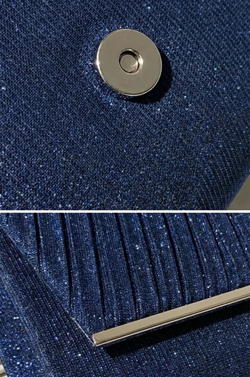 Close-up detail of night blue glitter fabric texture, pleated design, and silver magnetic snap closure.
