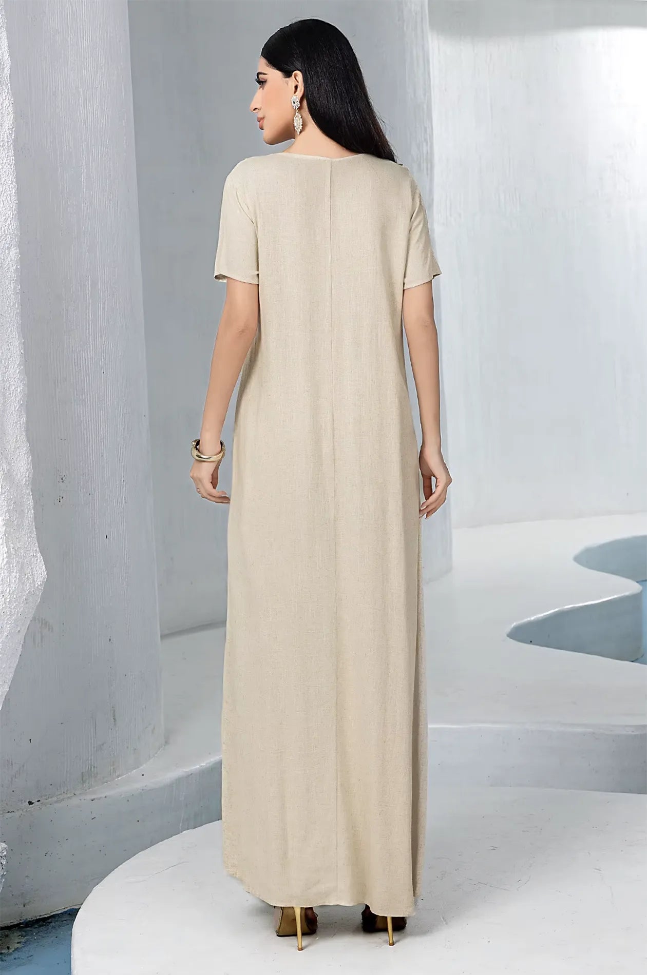 Back view of the simple and elegant beige linen inner maxi dress.