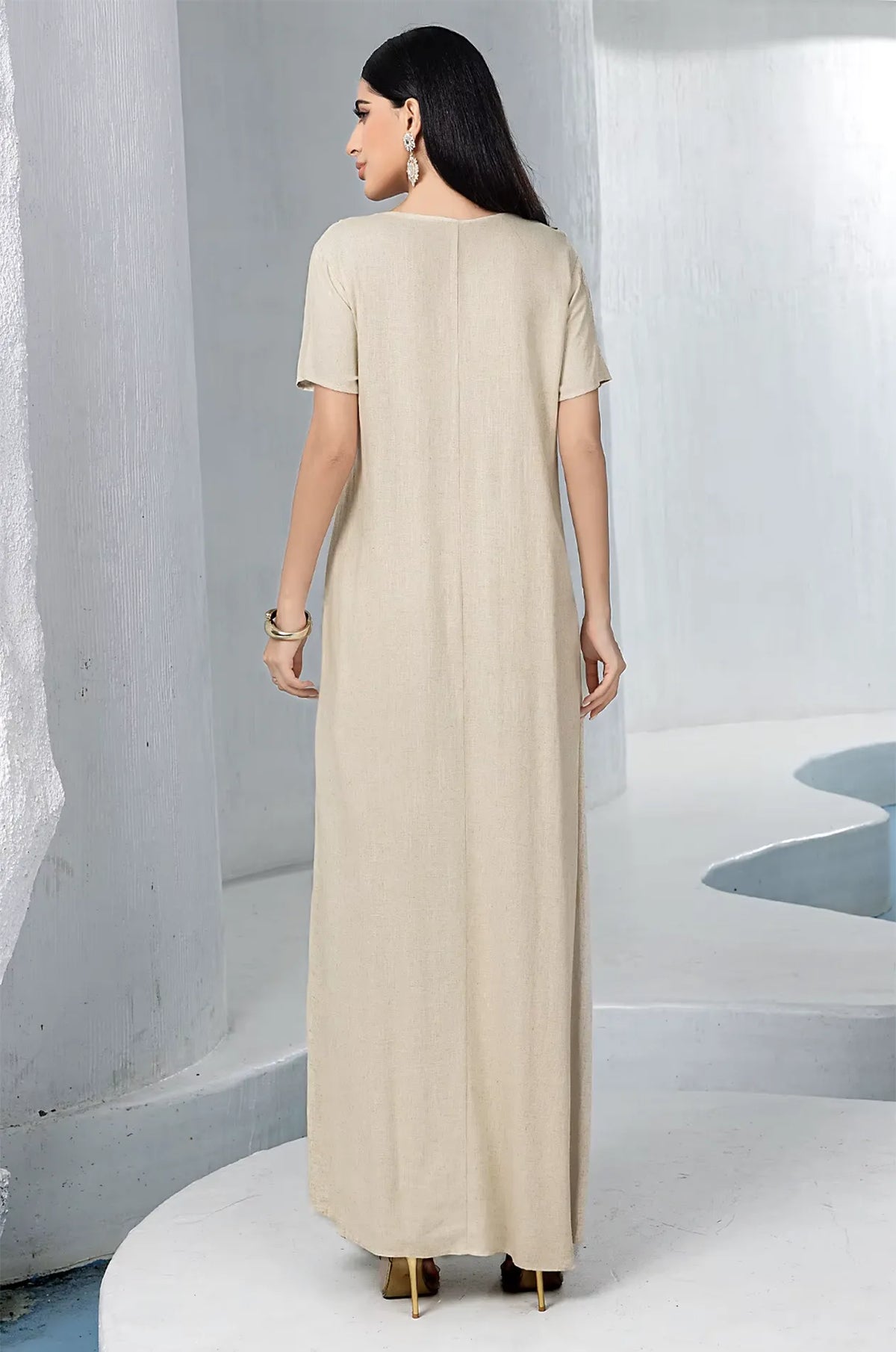 Back view of the simple and elegant beige linen inner maxi dress.