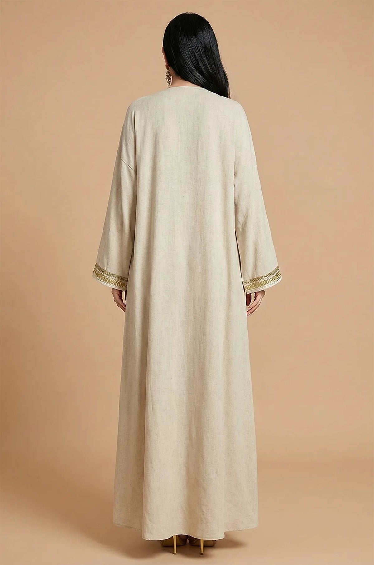 Rear view of the long-sleeved Ninon linen kaftan robe in sand beige.
