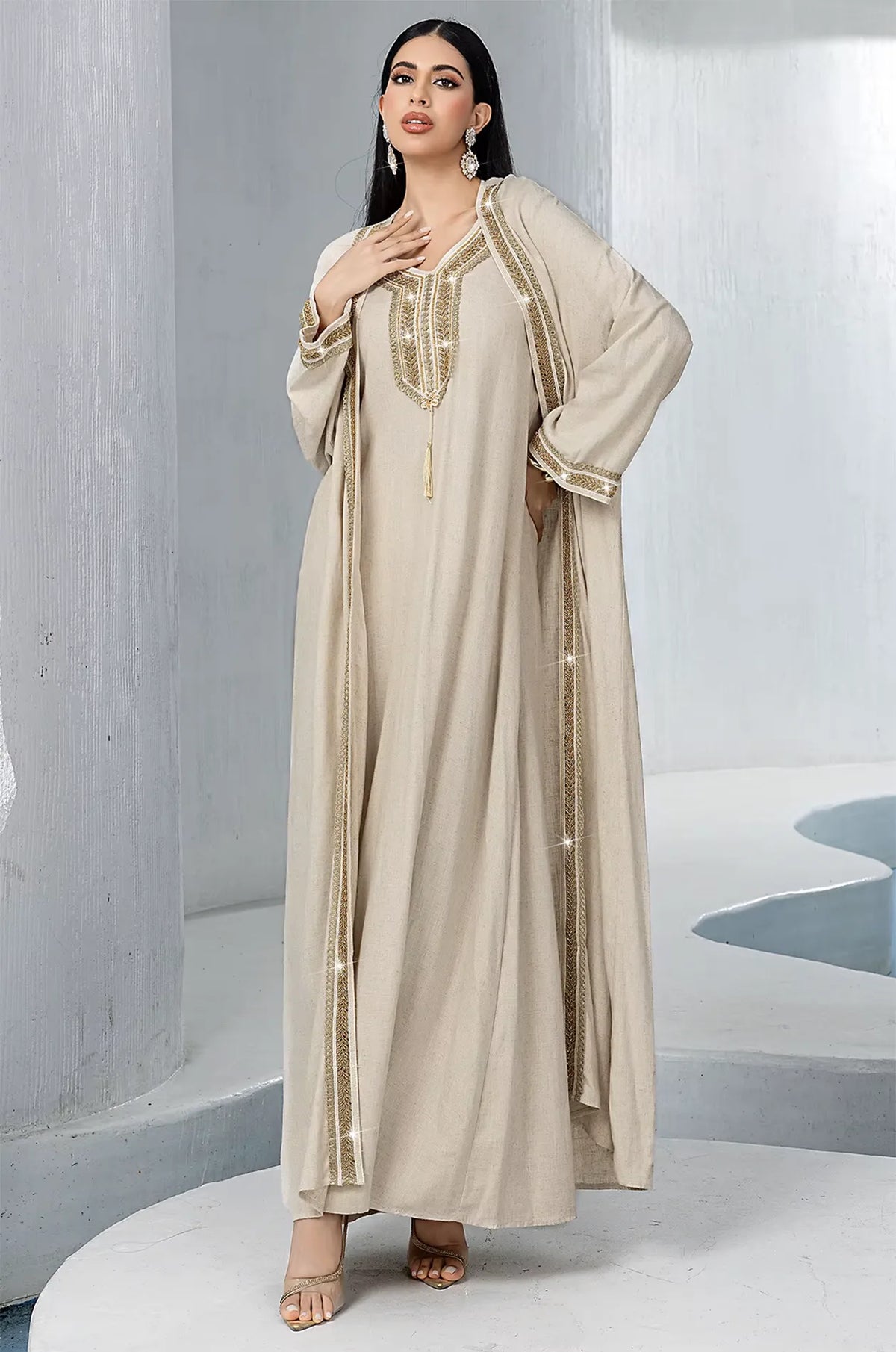 Close-up view of the metallic embroidery on the Ninon beige kaftan.
