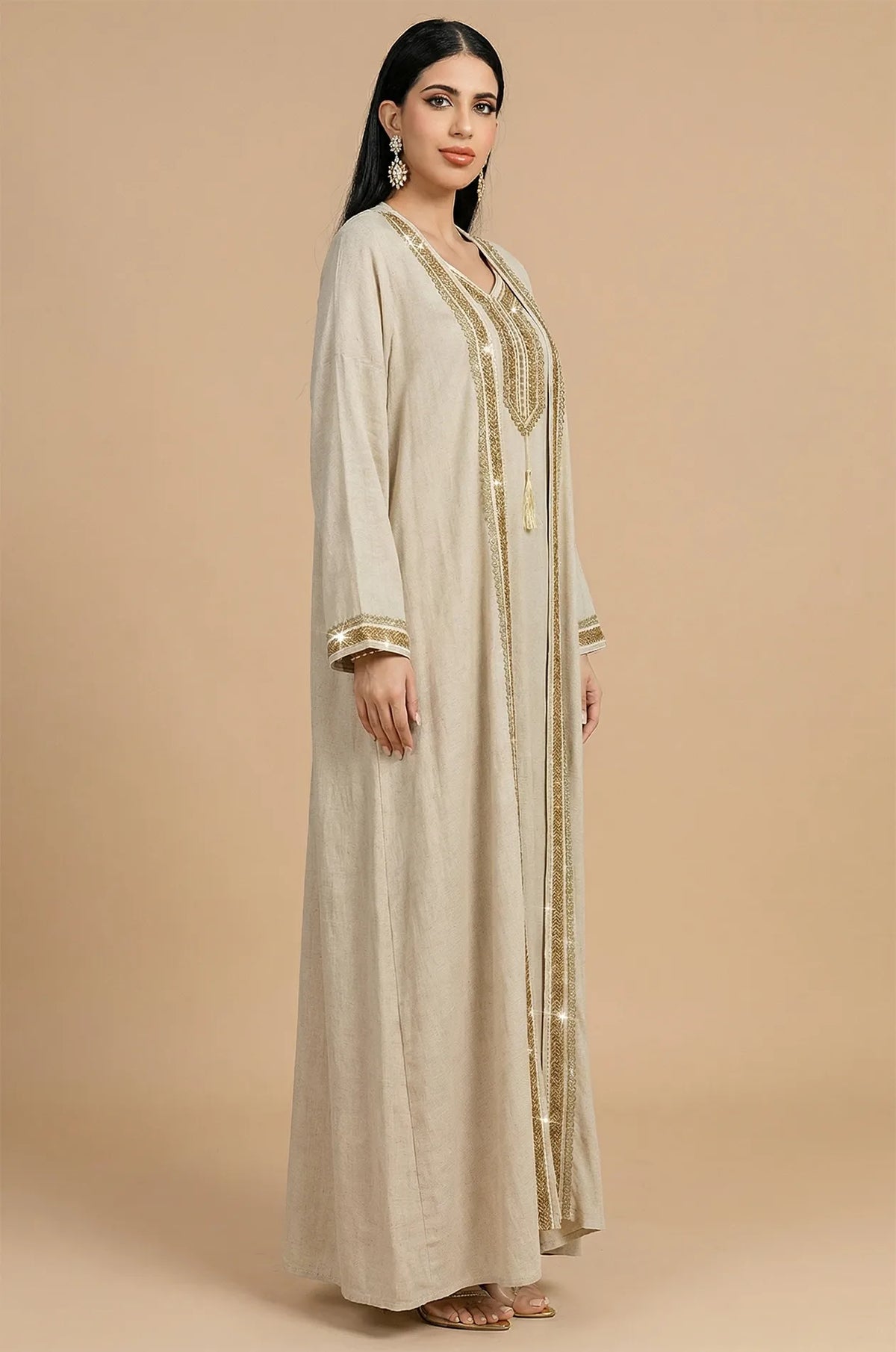 Side profile of the 2-piece Ninon beige kaftan showing flowy linen fabric.