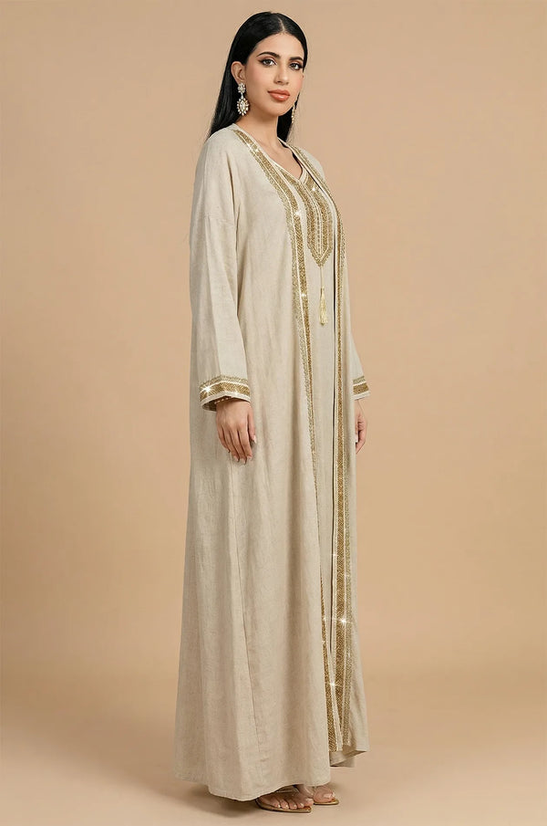 Side profile of the 2-piece Ninon beige kaftan showing flowy linen fabric.