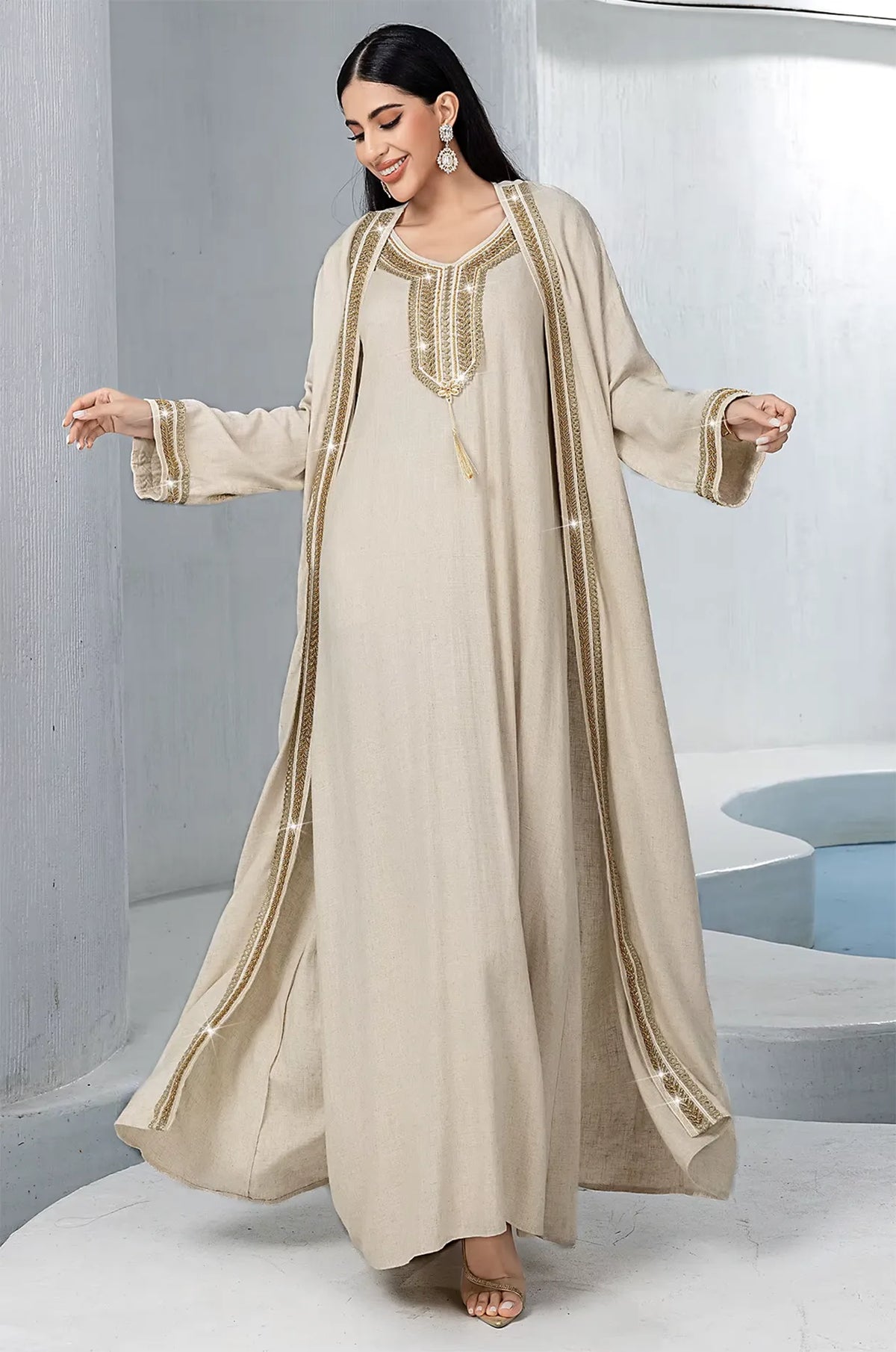 Model walking in the Ninon plus size linen kaftan showing garment movement.