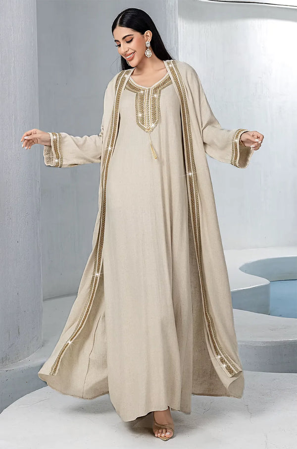 Model walking in the Ninon plus size linen kaftan showing garment movement.