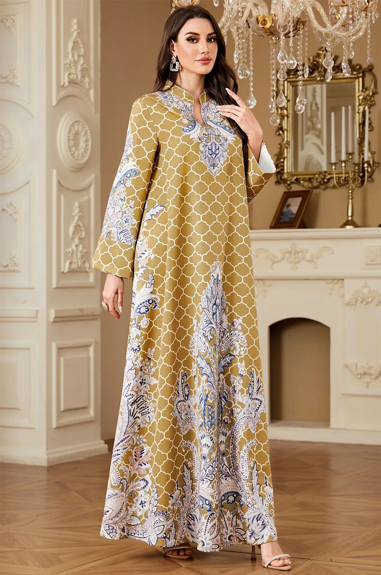 Elegant standing view of the Nirea yellow long-sleeve paisley kaftan, showcasing the vibrant mustard hue and flowing fit.