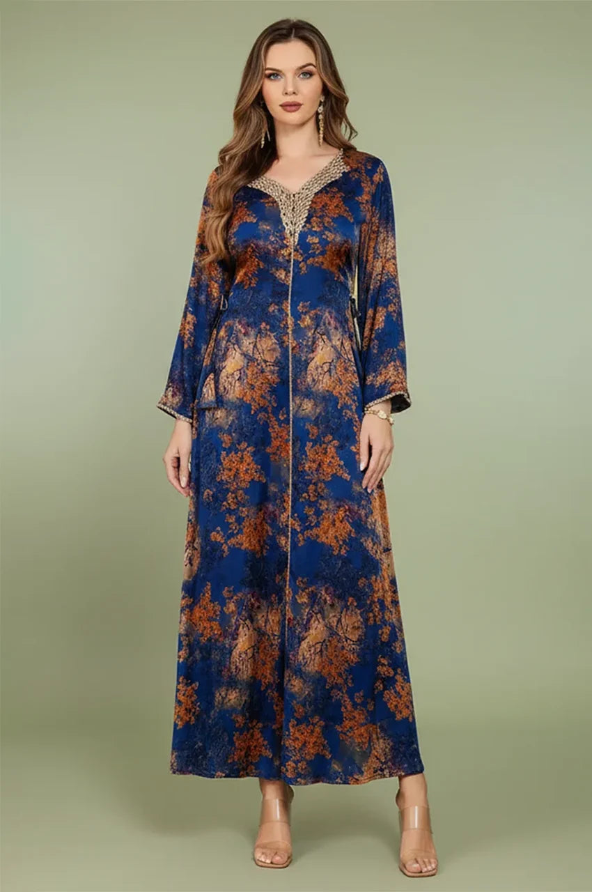 Front view of the Noria blue fitted kaftan with gold floral print and handmade sfifa neckline from Naylara.