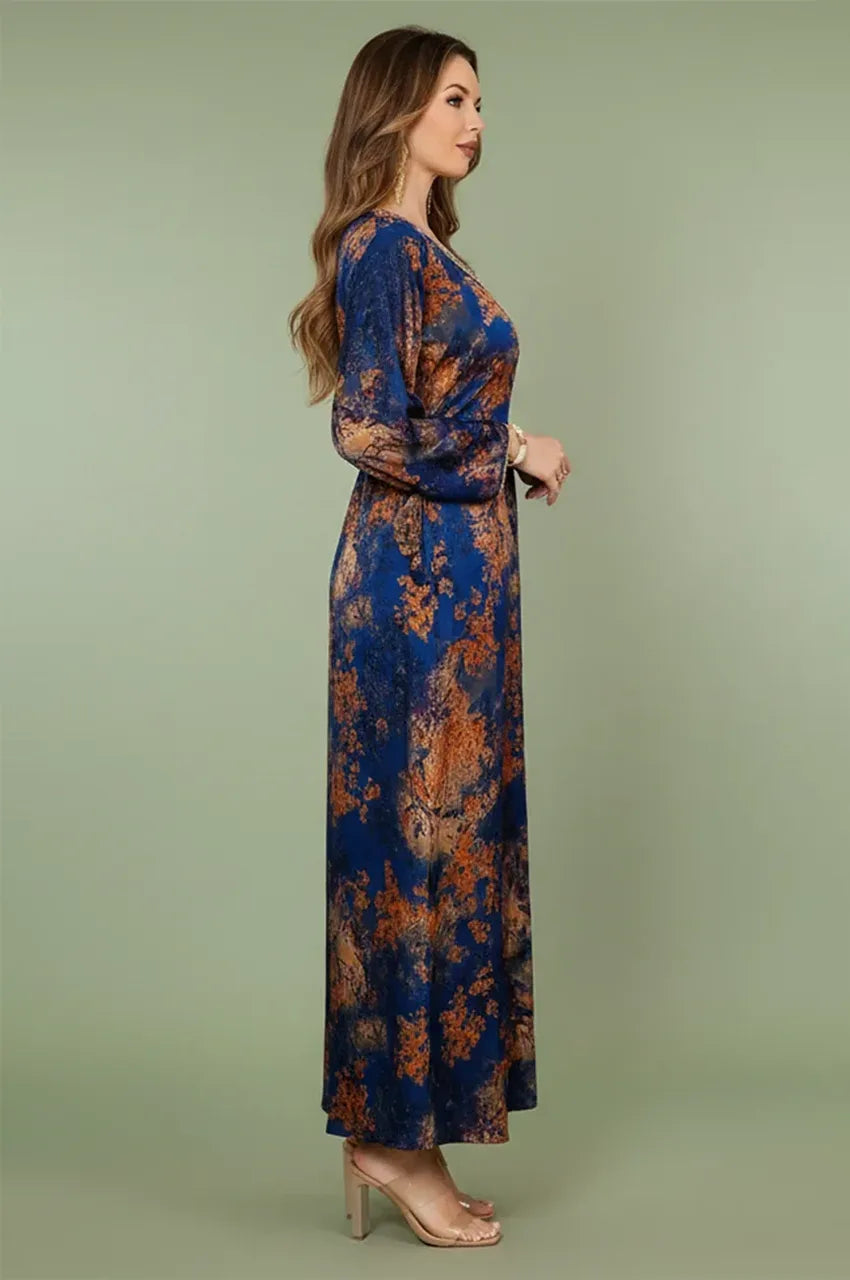 Side profile of the blue Noria fitted kaftan illustrating the adjustable fit and bell sleeves.