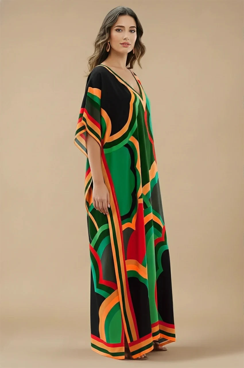 Side view of Novah green tropical kaftan featuring vibrant multicolor pattern and relaxed drape
