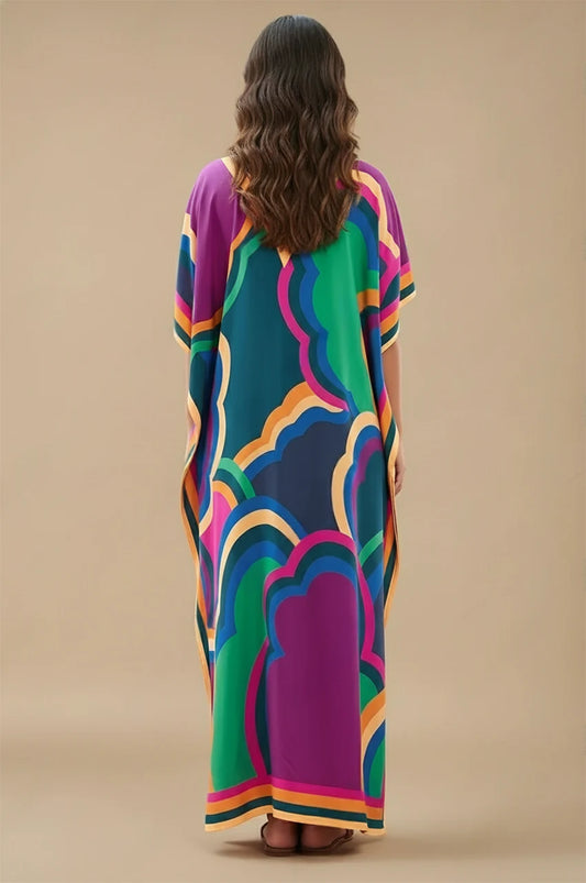 Back view of Novah Purple Tropical Kaftan with bold rainbow tropical patterns